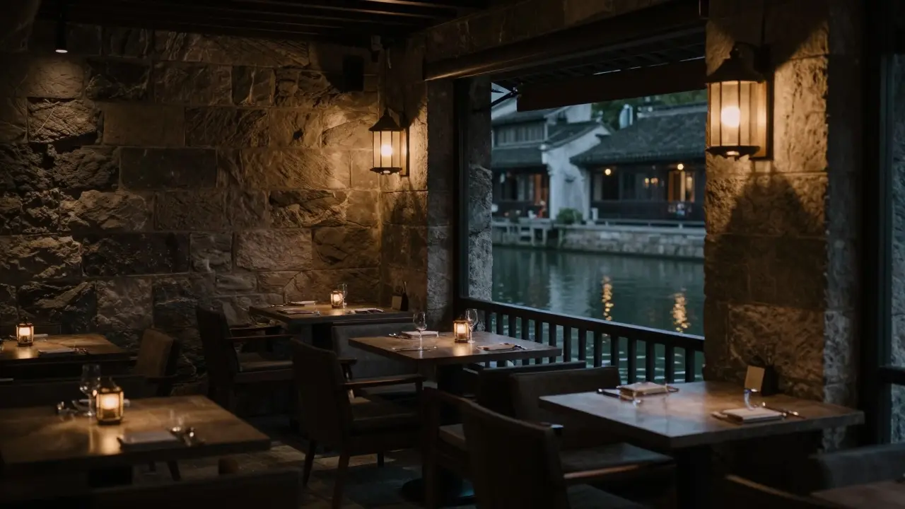 Intimate waterfront venue with traditional stone walls and warm lighting